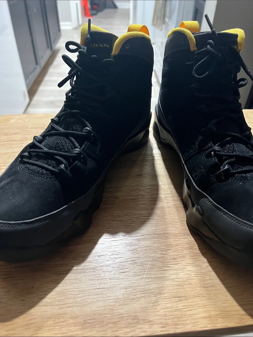 Jordan Black High-Top Sneakers with Yellow Trim
